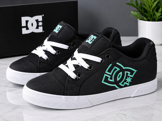 These are the DC Shoes Chelsea skate sneakers in black and aqua, featuring a prominent embroidered teal DC logo on the side